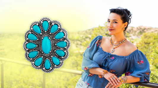 Model leaning on a railing outdoors with an American West Jewelry turquoise ring enlarged pictured next to her