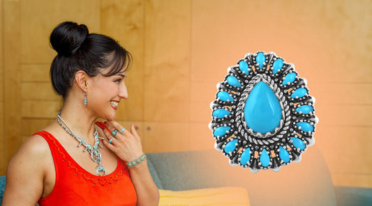American West Jewelry sterling silver Sleeping Beauty turquoise cluster ring alongside a woman wearing Kingman turquoise Naja necklace, earrings, rings, and bracelet celebrating Southwest turquoise jewelry